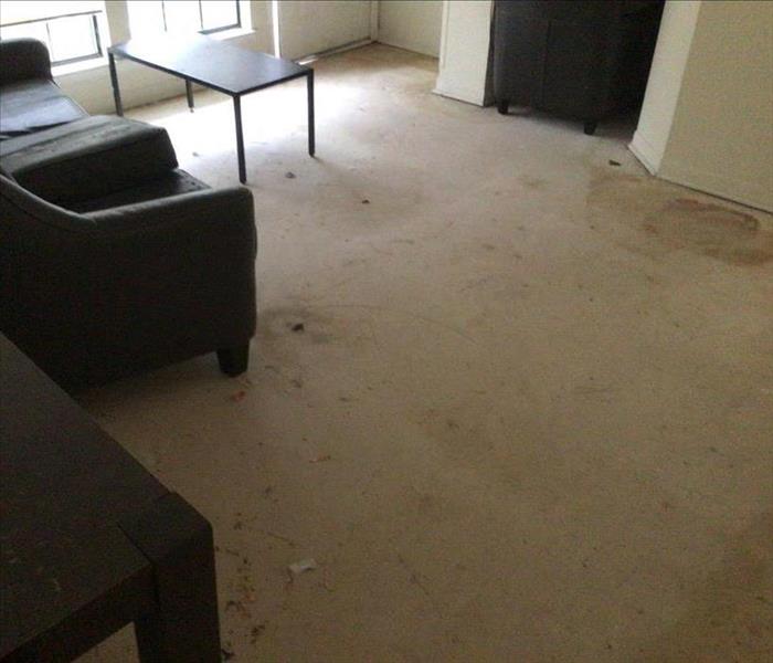 A Jackson County living room with removed flooring 