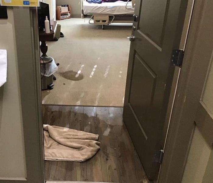 A hospital room with water damage