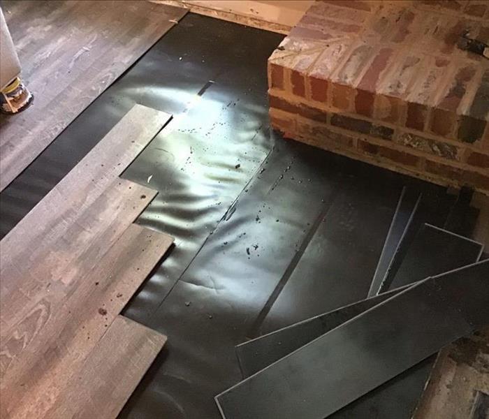 Damaged flooring being replaced by the SERVPRO of Jackson and Madison Counties professionals.